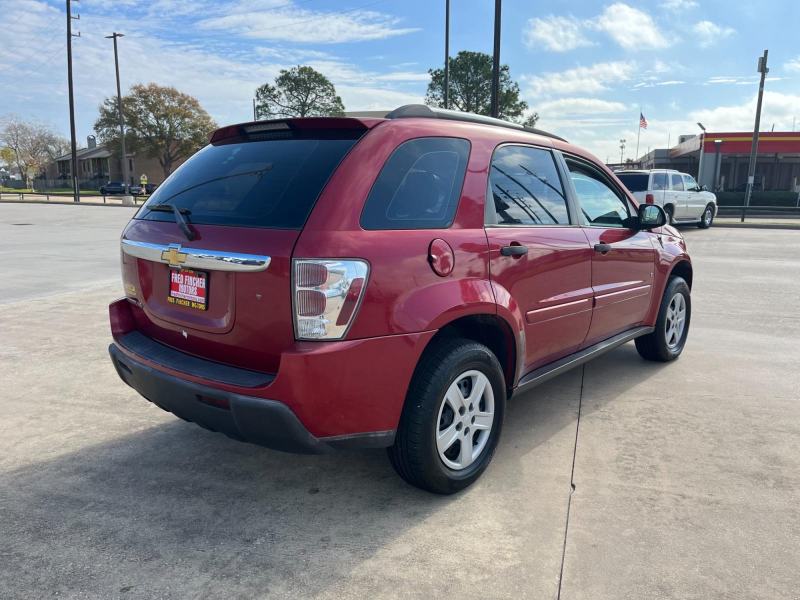 2006 red /TAN Chevrolet Equinox LS 2WD (2CNDL13F366) with an 3.4L V6 OHV 12V engine, 5-Speed Automatic transmission, located at 14700 Tomball Parkway 249, Houston, TX, 77086, (281) 444-2200, 29.928619, -95.504074 - Photo #6